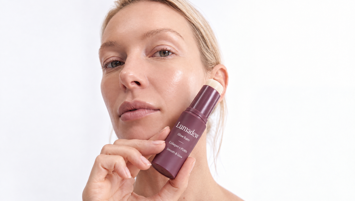 Woman holding the Lumadew Glow Balm